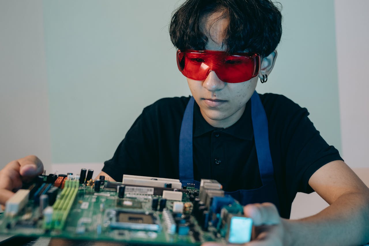 Close-up of a Man Holding a Motherboard